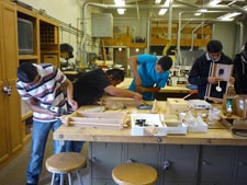 Students assembling clocks